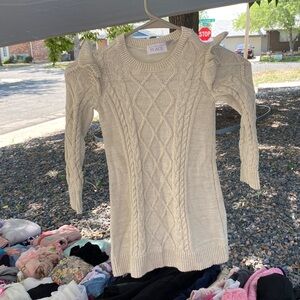 A Dress with pecks of gold and beige color